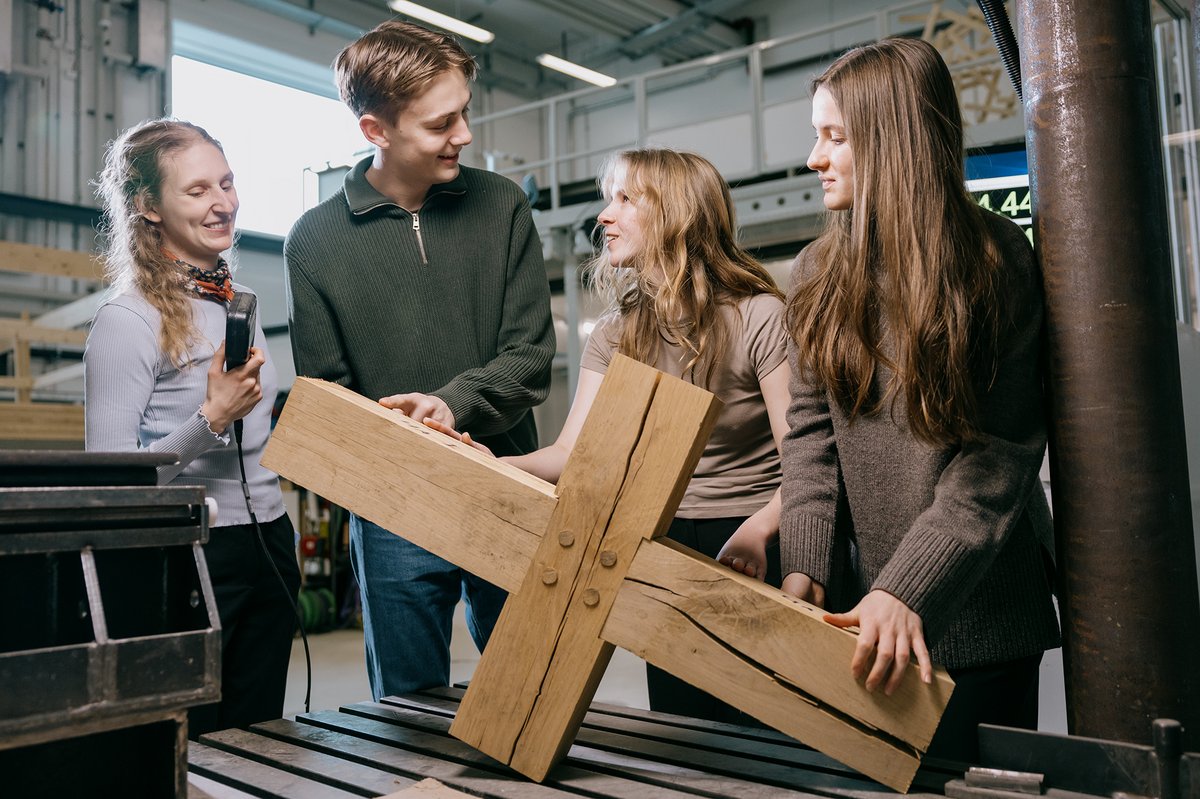Picture of four students in a workshop